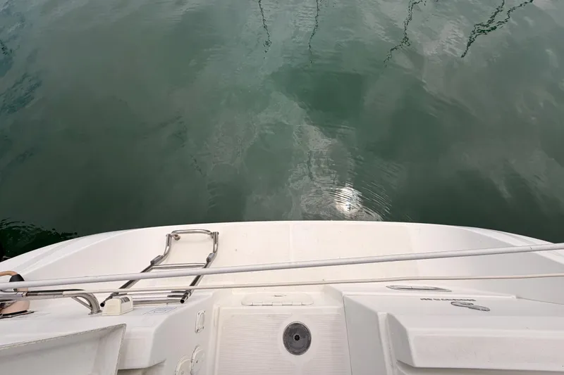 Slide: The Image of Beneteau Oceanis 34 sailboat stern view, 2010 model, reflecting on calm water. - 33