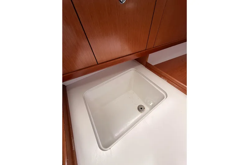 Slide: The Image of Interior sink of 2010 Beneteau Oceanis 34 yacht with wooden cabinetry. - 40