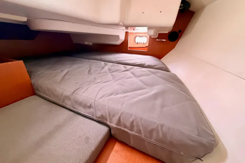 Slide: The Image of Cozy cabin interior of 2010 Beneteau Oceanis 34 sailboat with comfortable bedding. - 45