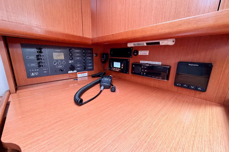 Slide: The Image of Control panel of a 2010 Beneteau Oceanis 34 sailboat with navigation equipment. - 53