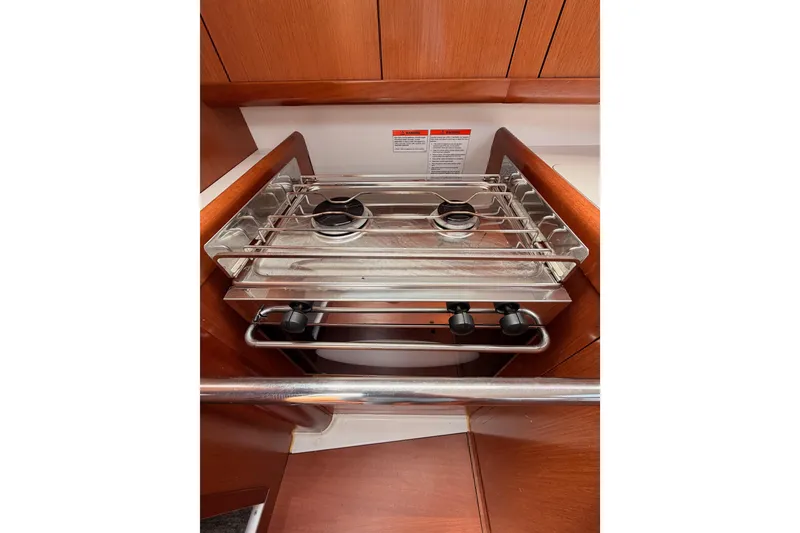 Slide: The Image of Compact stove in the galley of a 2010 Beneteau Oceanis 34 sailboat. - 68