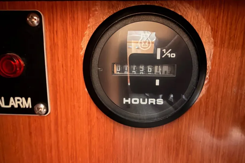 Slide: The Image of Hour meter on 2010 Beneteau Oceanis 37 sailboat dashboard, displaying engine hours. - 69