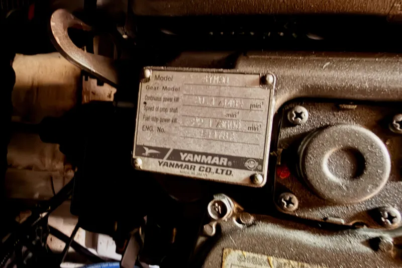 Slide: The Image of Engine plate of a 2010 Beneteau Oceanis 34 sailboat, featuring Yanmar specifications. - 71