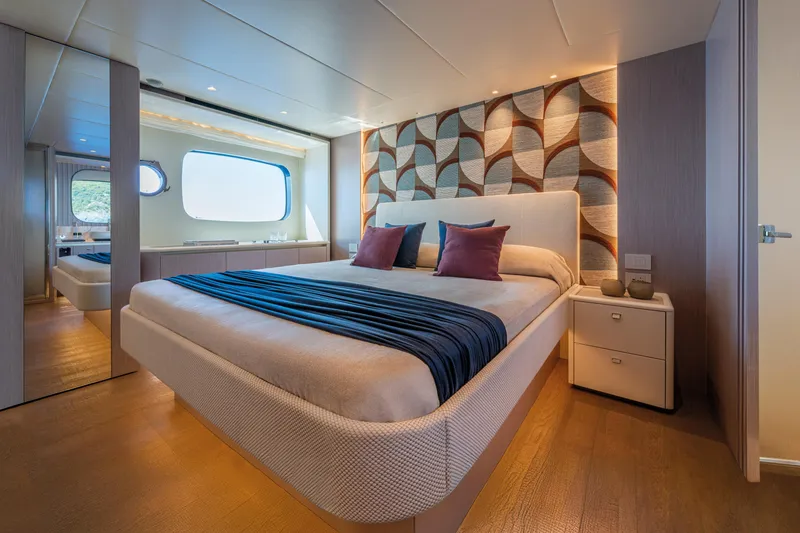 Slide: The Image of Luxurious bedroom on 2026 Absolute 62' Navetta yacht with modern decor and large window. - 25