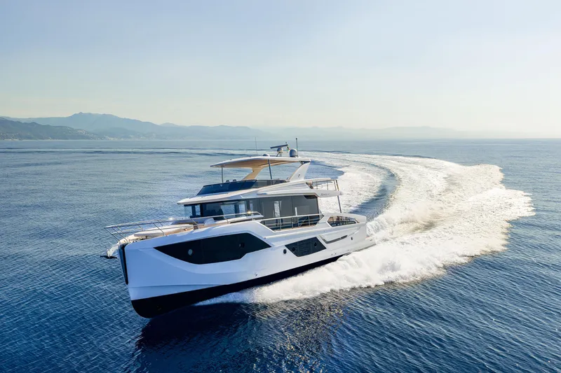 Slide: The Image of Luxurious 2026 Absolute 62' Navetta yacht cruising on open sea, creating a dynamic wake. - 3