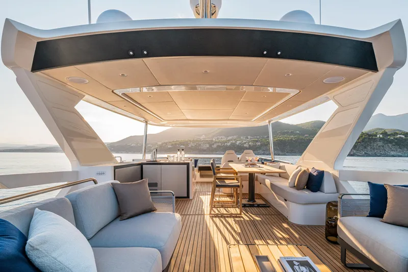 Slide: The Image of Luxurious deck of 2026 Absolute 62' Navetta yacht with elegant seating and scenic ocean view. - 7
