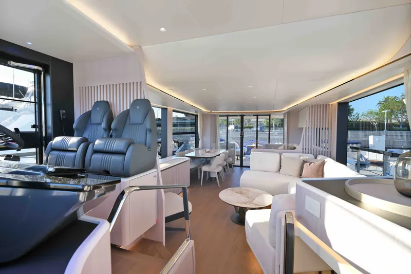 Slide: The Image of Luxurious interior of 2027 Absolute Navetta 62 yacht, featuring modern seating and elegant design. - 25