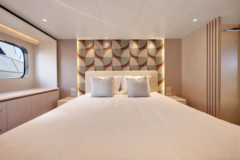 Slide: The Image of Luxurious bedroom interior of 2027 Absolute Navetta 62 yacht with modern design elements. - 52