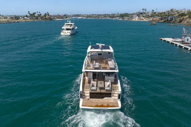 Slide: The Image of Luxury yacht Absolute Navetta 62 cruising in scenic coastal waters, 2027 model. - 9