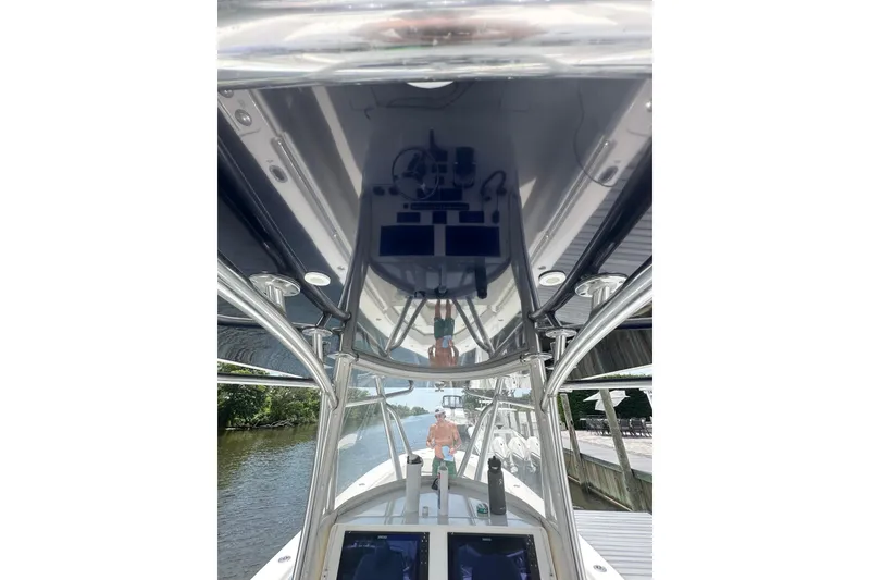 Slide: The Image of 2019 Contender 35 ST boat interior with reflective surfaces and navigation equipment. - 15