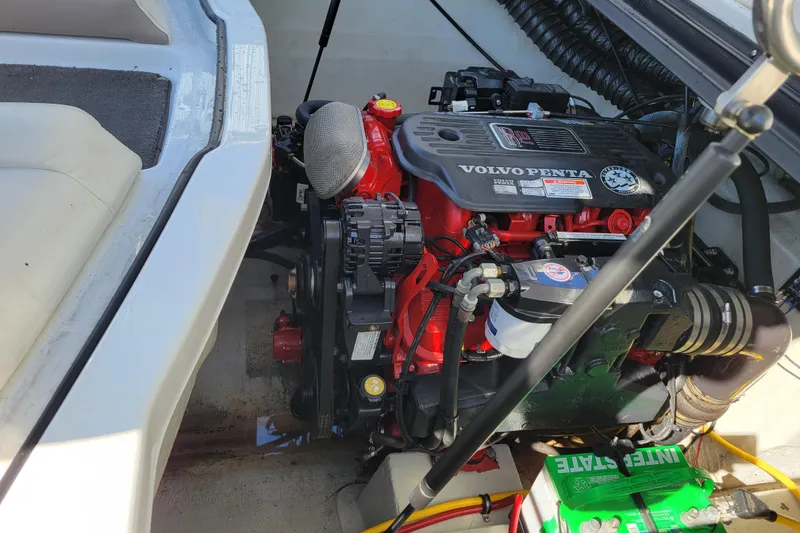 Slide: The Image of Engine compartment of a 2006 Cobalt 250 boat featuring a Volvo Penta engine. - 21