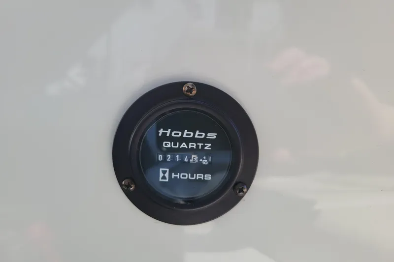 Slide: The Image of Hobbs Quartz hour meter on 2006 Cobalt 250, displaying 214.6 hours. - 22