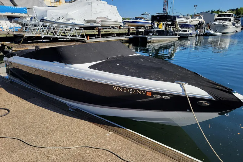 Slide: The Image of 2006 Cobalt 250 boat docked at marina, covered and ready for use. - 23