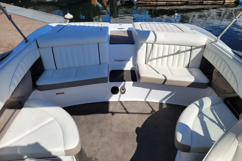 Slide: The Image of Interior of a 2006 Cobalt 250 boat with white leather seating. - 5