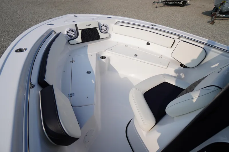 Slide: The Image of 2026 Tidewater 210 LXF boat interior with cushioned seating and modern design. - 5
