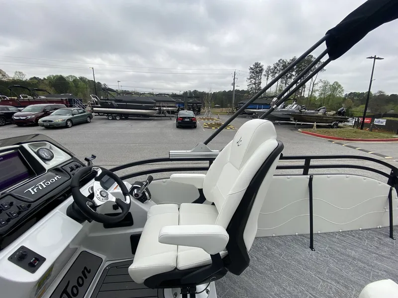 Slide: The Image of Interior of a 2023 JC Swing Back 27TT Sport boat in a parking lot. - 22