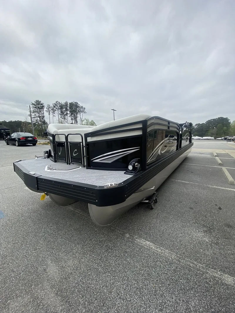Slide: The Image of 2023 JC Swing Back 27TT Sport pontoon boat in parking lot. - 42