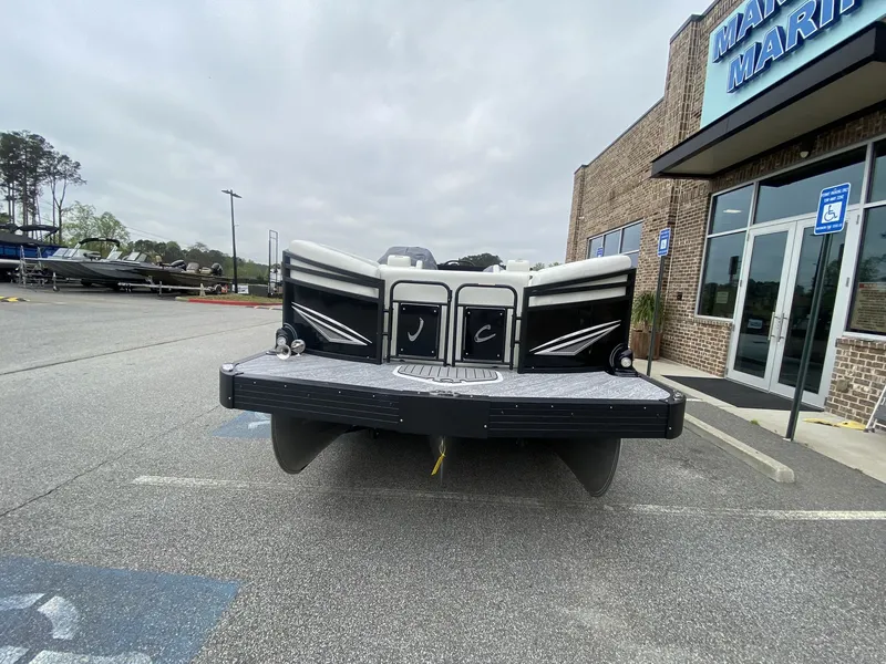 Slide: The Image of 2023 JC Swing Back 27TT Sport boat in front of a building. - 43