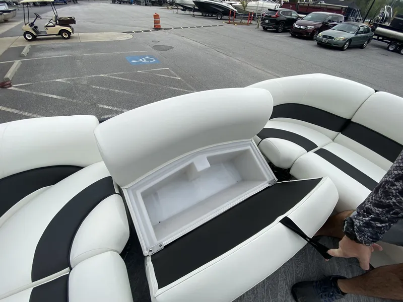 Slide: The Image of Interior of JC Swing Back 27TT Sport with open seat storage. - 48