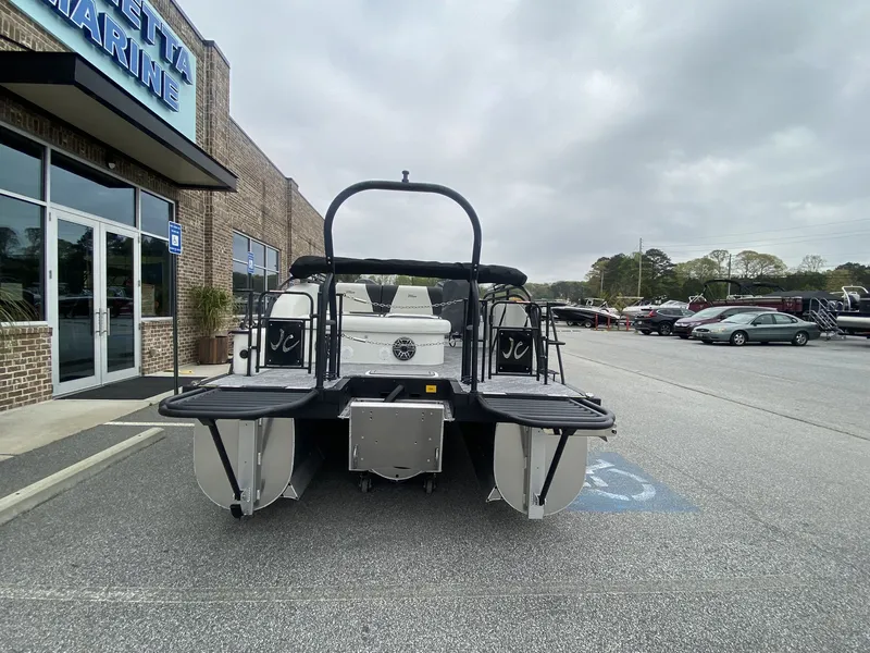 Slide: The Image of 2023 JC Swing Back 27TT Sport boat parked outside a building. - 9