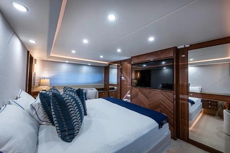 Slide: The Image of Luxurious bedroom interior of 2025 Maritimo M75 yacht with modern decor and ambient lighting. - 100