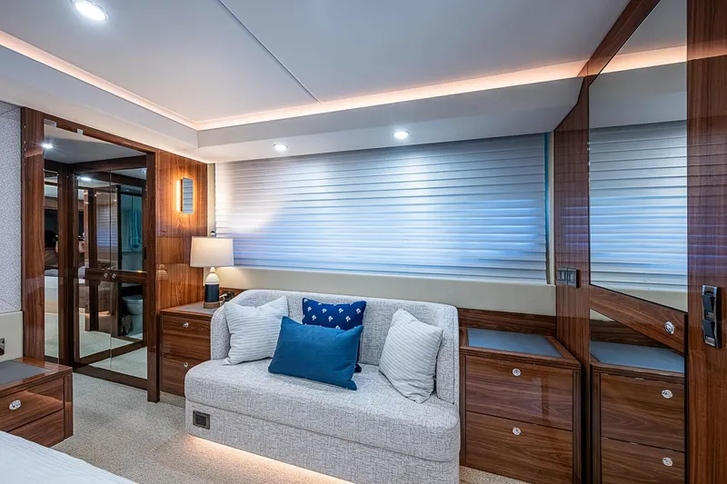 Slide: The Image of Luxurious interior of 2025 Maritimo M75 yacht with elegant wood finishes and cozy seating. - 104