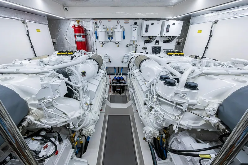 Slide: The Image of Engine room of 2025 Maritimo M75 yacht, featuring dual engines and modern equipment. - 113