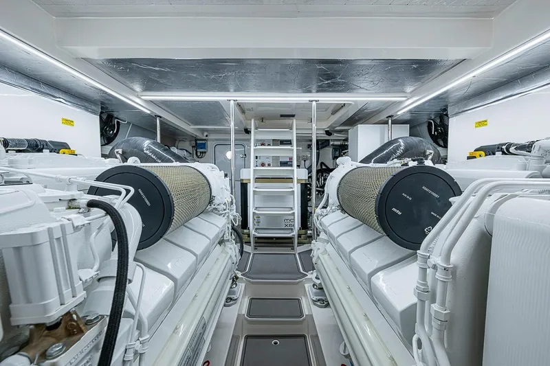 Slide: The Image of Engine room of 2025 Maritimo M75 yacht, featuring advanced machinery and clean design. - 114