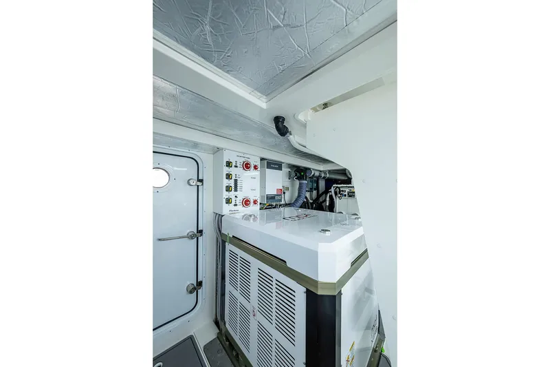 Slide: The Image of Engine room of 2025 Maritimo M75 yacht, featuring modern equipment and control panels. - 124