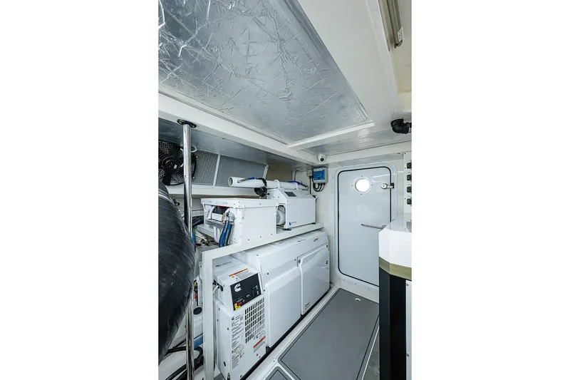Slide: The Image of Engine room of 2025 Maritimo M75 yacht, featuring modern equipment and sleek design. - 129