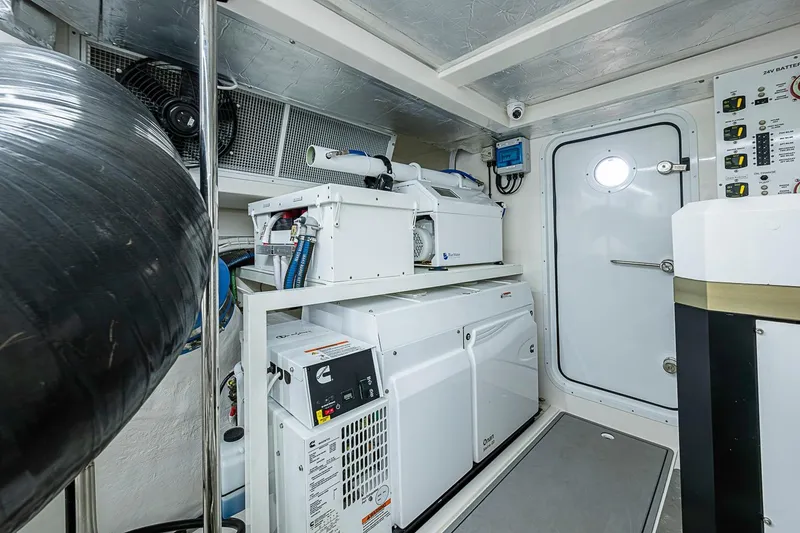 Slide: The Image of Engine room of 2025 Maritimo M75 yacht with equipment and control panels. - 130