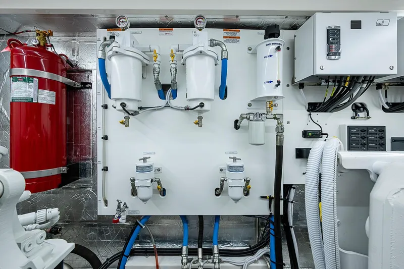 Slide: The Image of Engine room of 2025 Maritimo M75 yacht with fire extinguisher and filtration systems. - 131