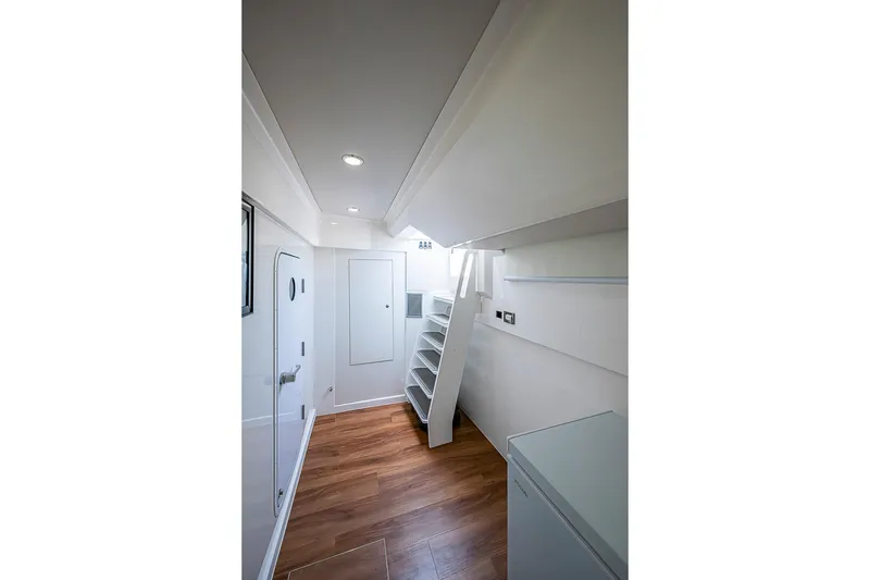 Slide: The Image of Interior of 2025 Maritimo M75 yacht, featuring sleek design and wooden flooring. - 133