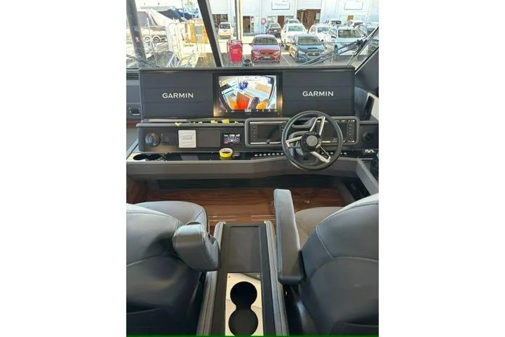 Slide: The Image of Helm of 2025 Maritimo M75 yacht with Garmin navigation displays and leather helm chairs - 23