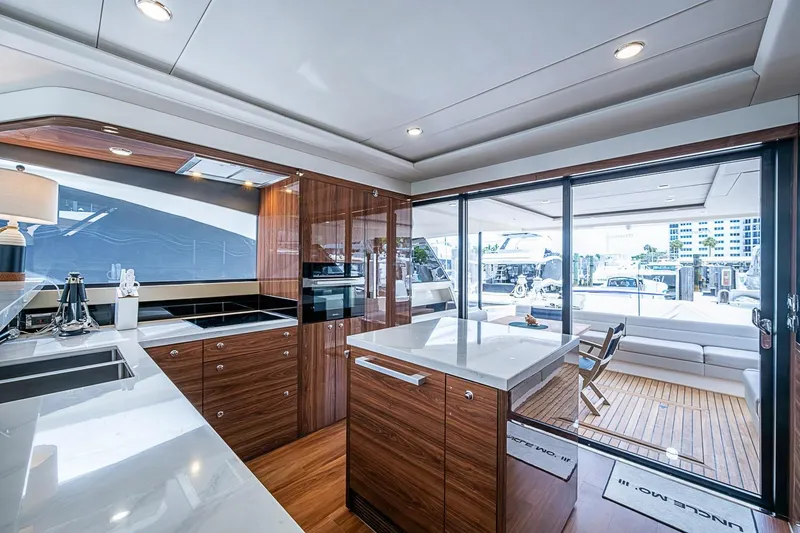 Slide: The Image of Luxurious interior of 2025 Maritimo M75 yacht with modern kitchen and spacious deck view. - 35