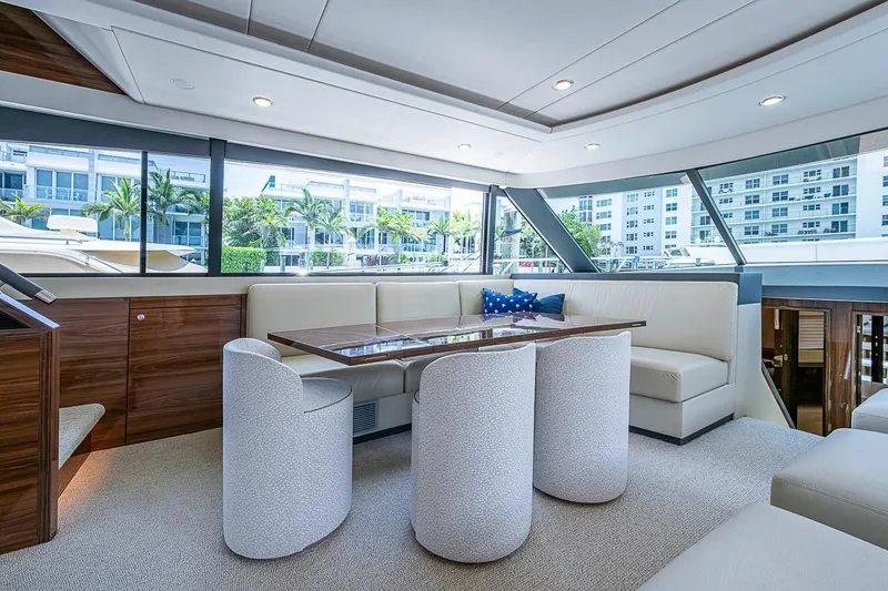 Slide: The Image of Luxurious interior of 2025 Maritimo M75 yacht with elegant seating and panoramic windows. - 41
