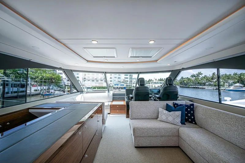Slide: The Image of Luxurious interior of 2025 Maritimo M75 yacht with modern seating and panoramic windows. - 50