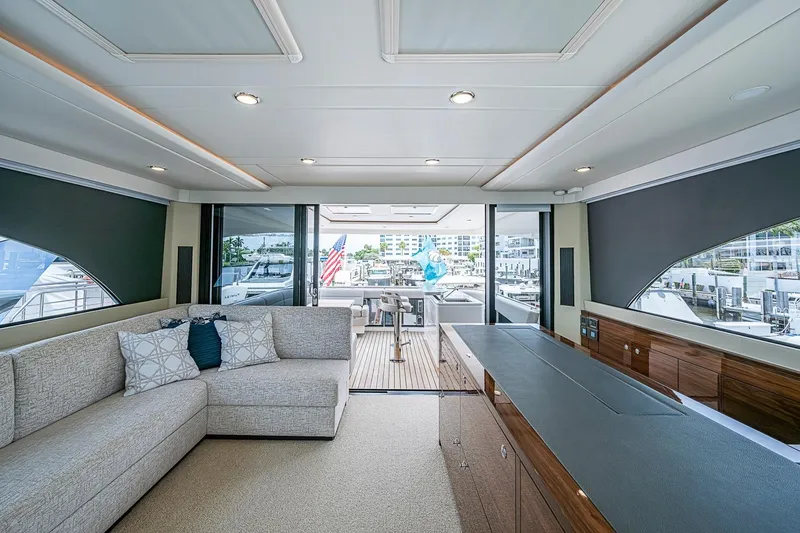 Slide: The Image of Luxurious interior of 2025 Maritimo M75 yacht with modern furnishings and marina view. - 51