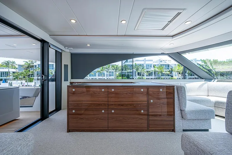 Slide: The Image of Luxurious interior of 2025 Maritimo M75 yacht with modern furnishings and large windows. - 55