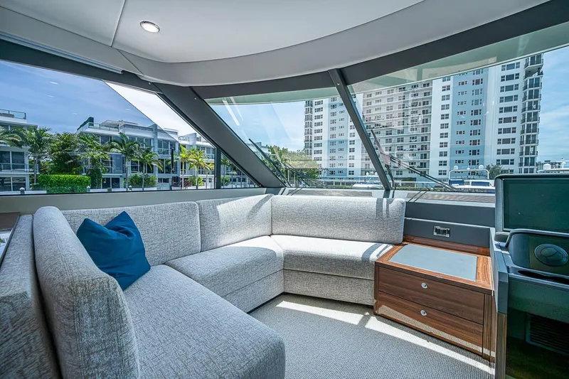 Slide: The Image of Luxurious interior of 2025 Maritimo M75 yacht with modern seating and cityscape view. - 57