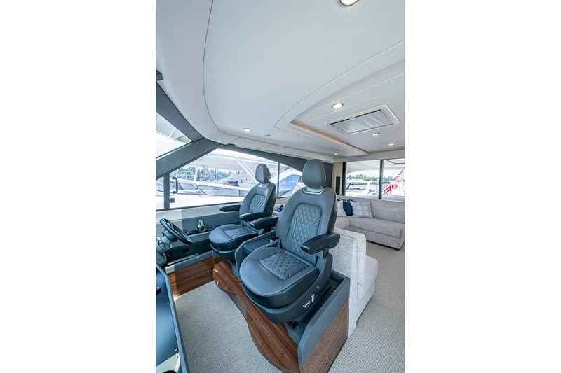Slide: The Image of Luxurious interior of 2025 Maritimo M75 yacht with plush seating and modern design. - 60