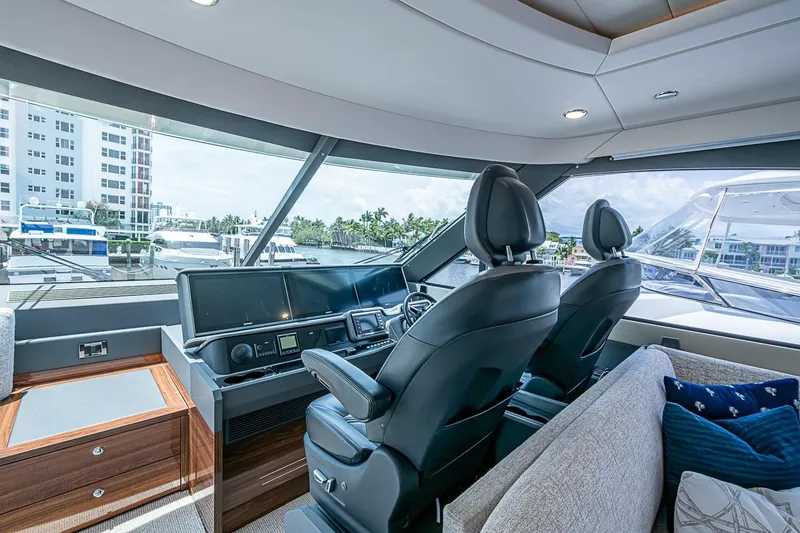 Slide: The Image of Interior view of 2025 Maritimo M75 yacht helm with modern controls and luxurious seating. - 61