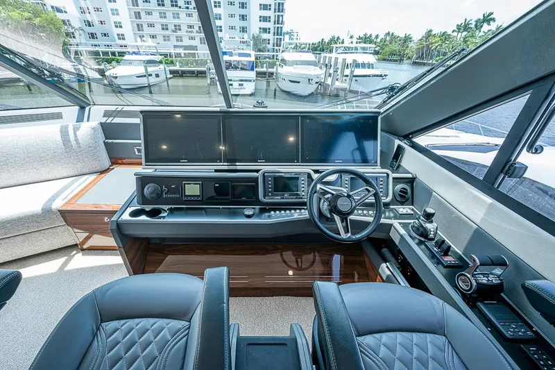 Slide: The Image of Luxurious 2025 Maritimo M75 yacht helm with advanced navigation systems and plush seating. - 63