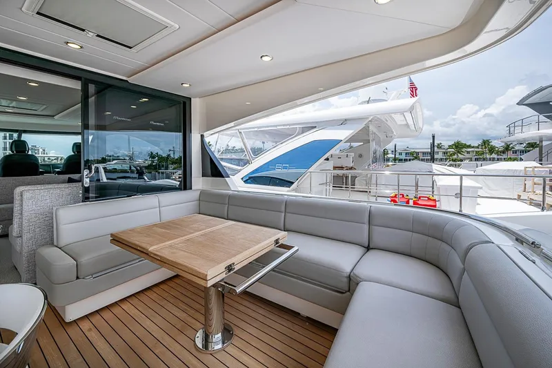 Slide: The Image of Luxurious 2025 Maritimo M75 yacht interior with elegant seating and wooden table. - 68
