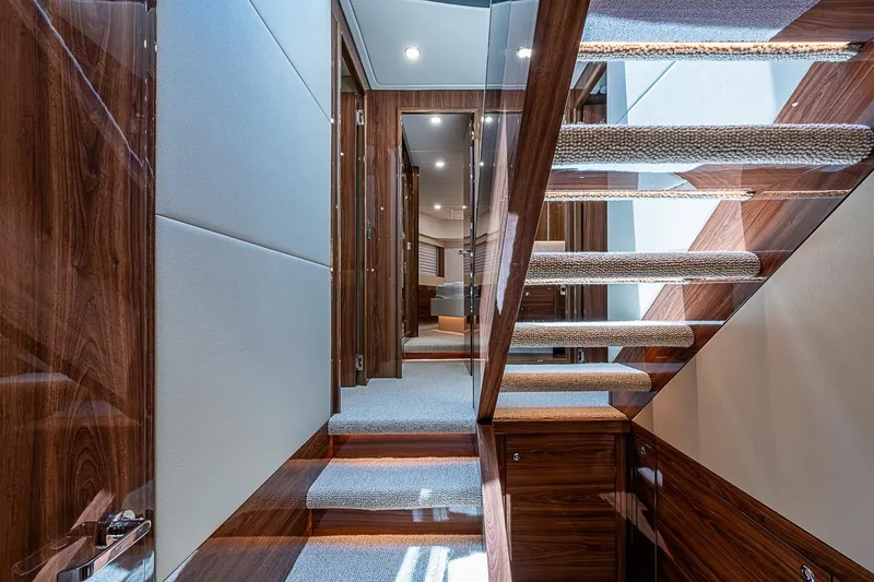 Slide: The Image of Luxurious interior staircase of 2025 Maritimo M75 yacht with elegant wood finish. - 72