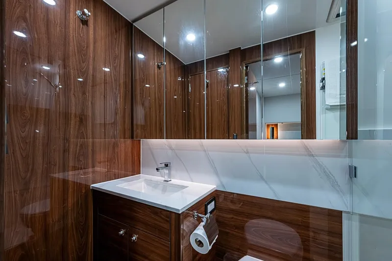 Slide: The Image of Luxurious bathroom in 2025 Maritimo M75 yacht with wood paneling and modern fixtures. - 74