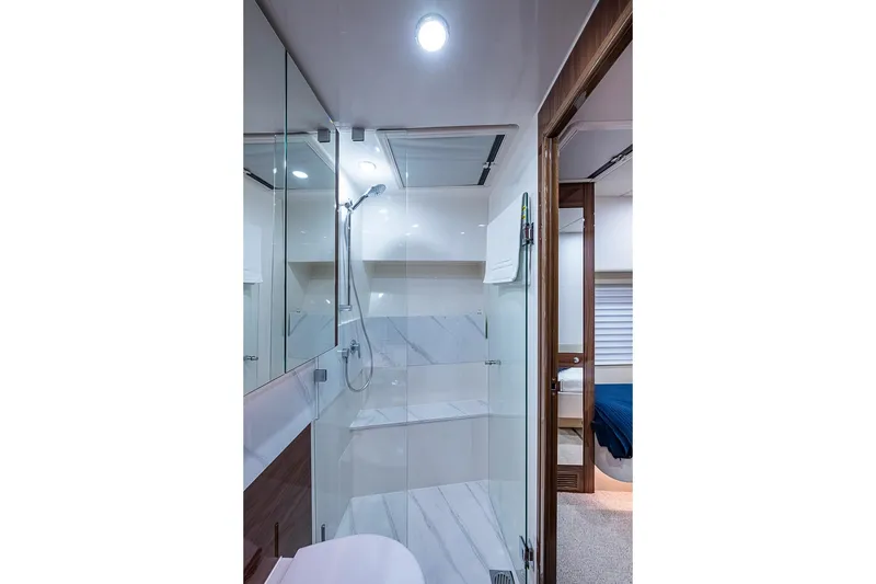 Slide: The Image of Luxurious bathroom in 2025 Maritimo M75 yacht with modern shower and elegant design. - 75