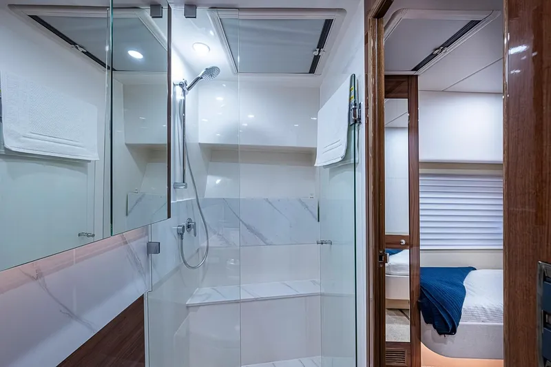 Slide: The Image of Luxurious bathroom interior of 2025 Maritimo M75 yacht with modern shower and elegant design. - 76
