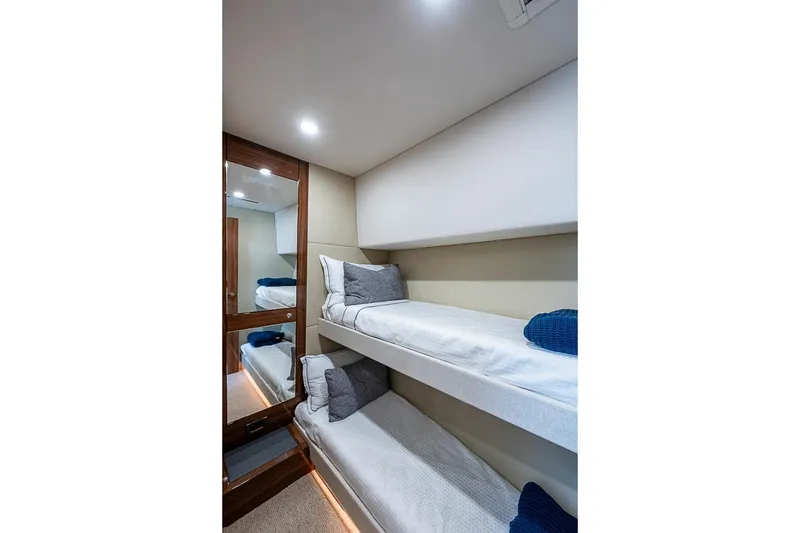 Slide: The Image of Luxurious bunk beds in the 2025 Maritimo M75 yacht cabin interior. - 81