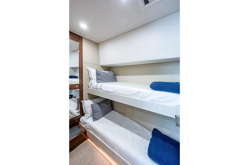 Slide: The Image of 2025 Maritimo M75 yacht interior with cozy bunk beds and modern design. - 82